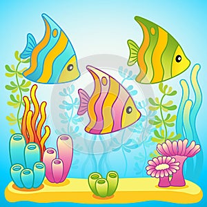 Cute tropical fish in blue water against the background of the seabed and alfalfa photo